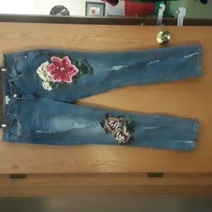 Jeans by Style size 10 with attached beautiful flowers. They look great on